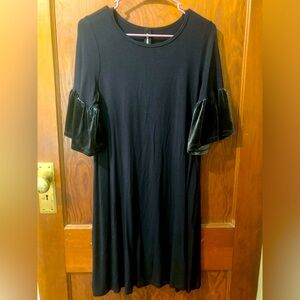 Navy blue midi dress with velvet flare sleeves.